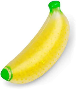 A vibrant, squishy jelly toy shaped like a banana. The toy features a bright yellow body with a glossy finish and green accents at both ends. Its flexible texture and playful design make it an engaging fidget item.