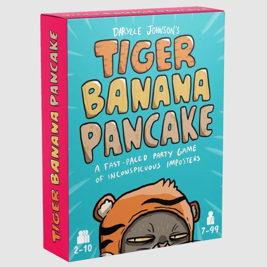 Tiger Banana Pancake game box featuring vibrant colors and playful artwork. The box showcases a cartoon character in a tiger outfit with an inquisitive expression. The title is displayed prominently, and the tagline describes it as a fast-paced party game for 2-10 players, ages 7 and up, focusing on inconspicuous imposters.