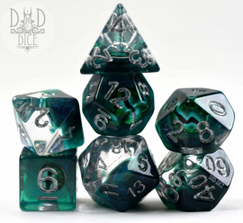Watchful Eye Reptile 7-piece RPG dice set by DND Dice. The set includes various polyhedral dice made of translucent material with green and black swirls, featuring silver numbers. The dice are arranged attractively, showcasing their unique designs and colors, ideal for tabletop gaming enthusiasts.