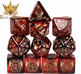A close-up image of the Draconic Descent 11-piece RPG dice set made by King of Crits. The dice are eye-catching with a translucent red color and intricate gold engravings depicting dragons and other fantasy motifs. The set includes various shaped dice, arranged in an artistic stack, perfect for tabletop RPG games. The King of Crits logo is visible in the top left corner, enhancing the branding.