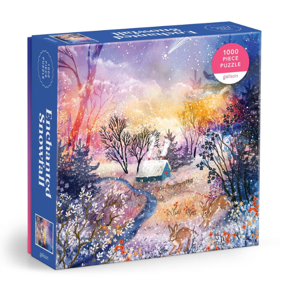 Galison's Enchanted Snowfall jigsaw puzzle featuring a beautiful winter scene with a cozy cottage, snow-covered trees, and playful deer amidst a colorful, starry sky. The puzzle includes 1000 interlocking pieces for hours of engaged entertainment.