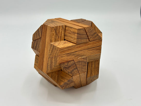 Stewart Coffin's Egyptian - STC 23A is a beautifully crafted mechanical puzzle made from high-quality wood. The intricate design features interlocking pieces that challenge the mind while providing a tactile experience. This appealing puzzle is ideal for fans of brain-teasers and those who appreciate fine craftsmanship.