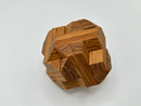 The Egyptian - STC 23A is a beautifully crafted mechanical puzzle made by Stewart Coffin. It features intricately interlocking wooden pieces in a natural finish, providing a challenging yet rewarding experience for puzzle enthusiasts. The design showcases geometric shapes and smooth edges, set against a clean white background.