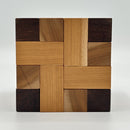 Convolution - STC #30 mechanical puzzle by Stewart Coffin. Features an intricate design made of various wood pieces, showcasing a unique interlocking structure that challenges problem-solving skills.