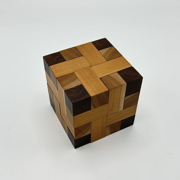 Convolution - STC #30 mechanical puzzle by Stewart Coffin, featuring an intricate design of interlocking wooden pieces in warm tones, perfect for puzzle enthusiasts.