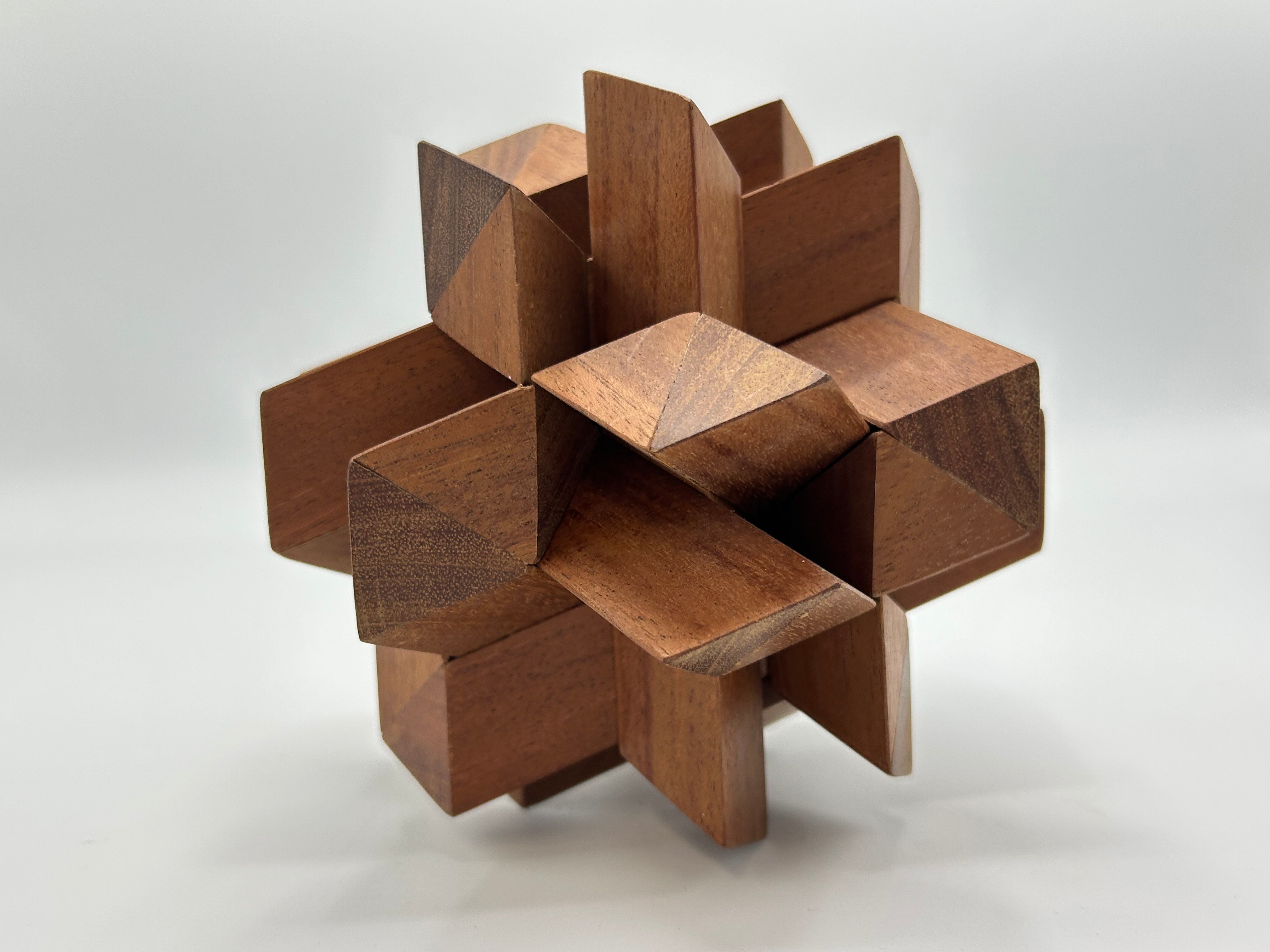 Twelve Piece Separation-STC 85 mechanical puzzle by Stewart Coffin, showcasing intricate wooden design with interlocking pieces forming a complex shape, ideal for puzzle enthusiasts.