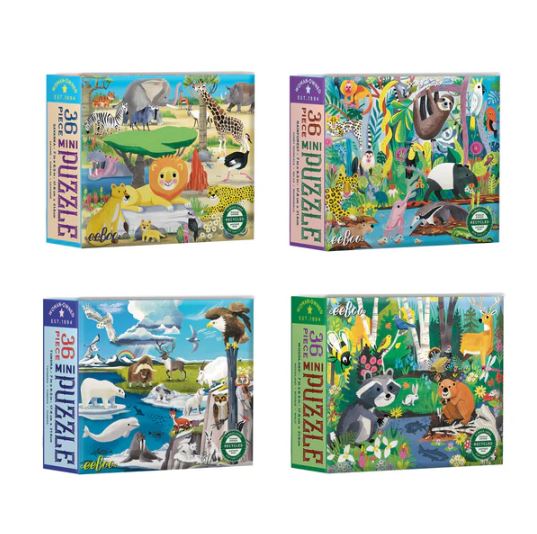 A colorful assortment of four jigsaw puzzle boxes from Eeboo featuring wild habitats. Each box displays vibrant illustrations of various animals in their natural environments, including lions, zebras, polar bears, and more, with 36 pieces per puzzle.