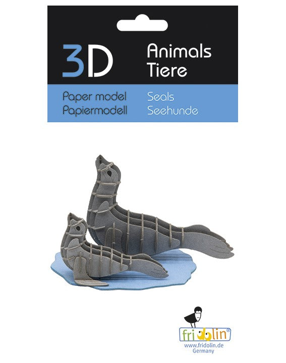 3D Paper Model of two seals, made from high-quality cardboard. One seal is sitting upright while the other is lying down, both positioned on a blue base. Ideal for DIY enthusiasts and model collectors.