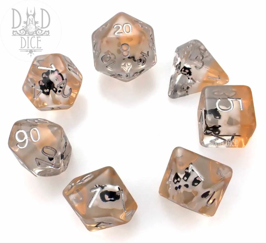 The Doggonit 7pc RPG Dice Set includes seven uniquely designed polyhedral dice in shades of smoky gray and transparent. Each die features clear, engraved numbers and intricate designs on their faces, ideal for tabletop gaming and role-playing adventures.