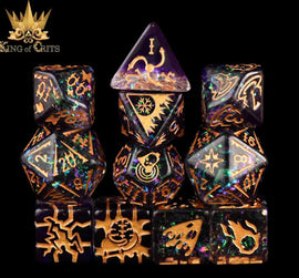 Archmage 11-piece RPG Dice Set by King of Crits, featuring a variety of intricately designed polyhedral dice in a sparkling black and gold color scheme. The set includes D4, D6, D8, D10, D12, and D20 dice, all showcasing vibrant, mystical symbols that enhance your tabletop gaming experience. Perfect for RPG enthusiasts and collectors alike.