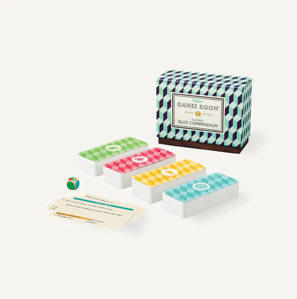 The Classic Quiz Compendium by Chronicle Books, featuring a colorful box with 'Games Room' on the front. Inside, there are several stacks of quiz cards in vibrant colors, accompanied by a small game die. Ideal for trivia lovers and family game nights.