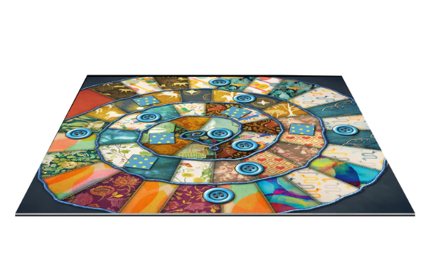 Patchwork: 10th Anniversary Edition board game by Lookout Games featuring a circular board with colorful patchwork designs and blue buttons. The game is set up with various pieces and patterns, designed for a rich gaming experience.