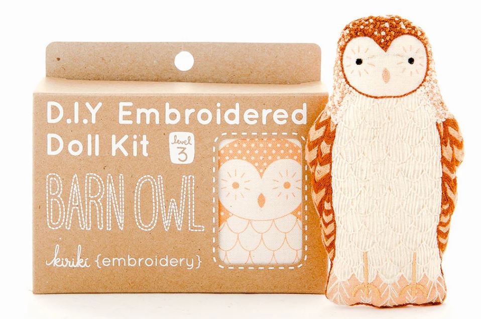 Barn Owl Doll Embroidery Kit by Kiriki Press. The kit contains materials to create an embroidered owl doll, with a cute design featuring textures in cream and orange. Box showcases a stitched owl illustration alongside the product title 'Barn Owl' and the skill level '3'.