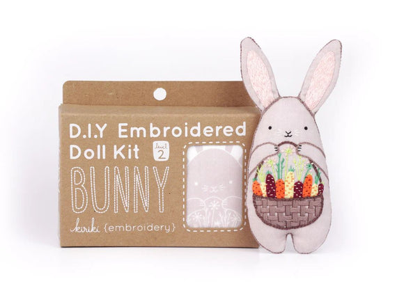 Bunny Doll Embroidery Kit by Kiriki Press. This DIY kit features a cute bunny character holding a basket of colorful vegetables. The packaging displays the instructions and kit level as 'level 2'. Perfect for embroidery enthusiasts looking for a fun and creative project.
