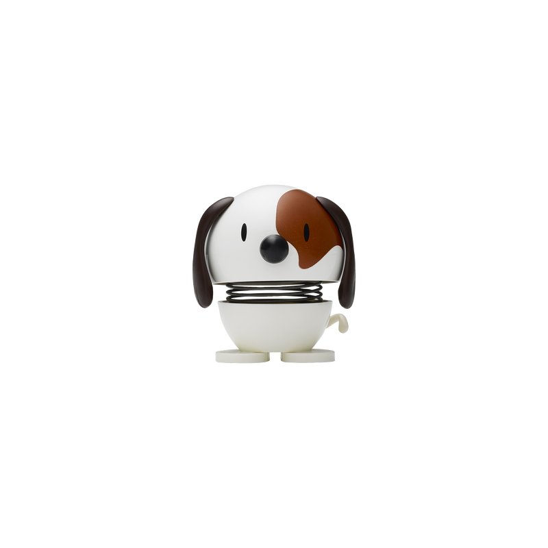 A charming Hoptimist Dog in white with a playful brown patch over one eye. The dog features a round body with movable legs and a cheerful expression, making it a delightful decorative item for the home or office.