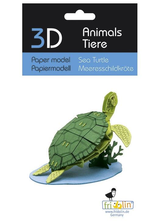 A colorful 3D paper model of a sea turtle designed by fridolin, featuring intricate detailing on the shell and flippers. The turtle is displayed on a blue base with a coral-like structure, showcasing the vibrant greens and yellows of the model.