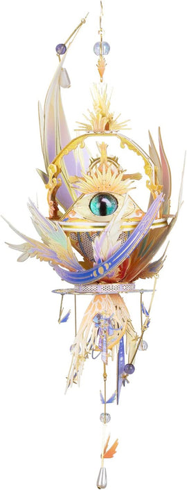 The Eye of God DIY kit by Mu Model featuring a beautifully crafted design with intricate details. The central eye is surrounded by colorful feathers and radiant embellishments, making it a stunning decorative piece.