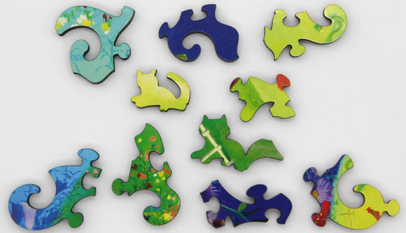 Colorful puzzle pieces shaped like animals on a white background