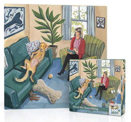 A golden retriever sits on a teal couch on its back, belly up. A woman in a red blazer and black high heels sits with her legs crossed over the knee in a striped green chair holding a pen and notebook. There are dog toys scattered around the room - a large bone-shaped pillow, yellow tennis ball, and stuffed animals. 