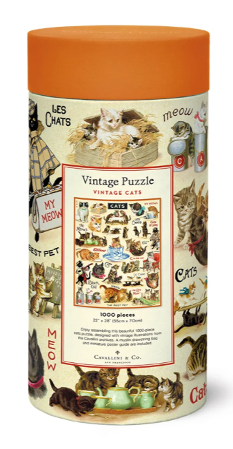 Vintage Puzzle Vintage Cats 1000-piece jigsaw puzzle in a cylindrical cardboard box with an orange lid, featuring retro cat illustrations and a central puzzle box graphic.