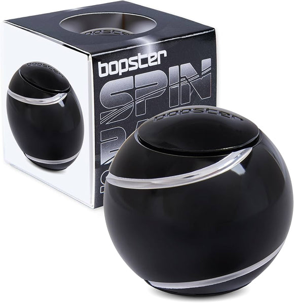 A black spin ball with its packing behind it