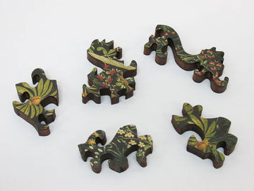 Uniquely shaped wooden puzzle pieces