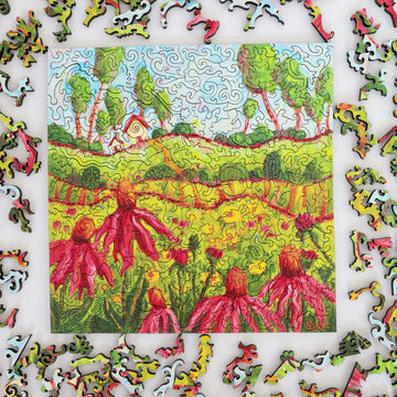 Colorful puzzle with a partially completed landscape scene featuring trees and flowers.