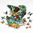 Partially assembled puzzle depicting moths, showing whimsy pieces shaped like insects