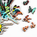 Closeup of moth-shaped whimsy pieces and other pieces