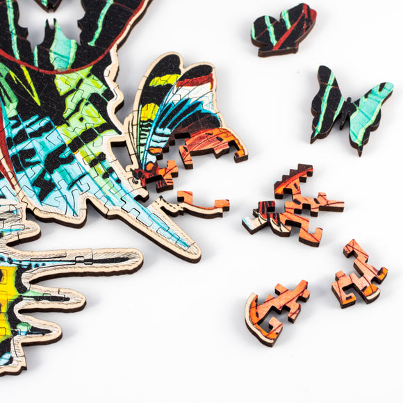 Closeup of moth-shaped whimsy pieces and other pieces