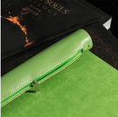 A vibrant green roll-up leatherette dice mat featuring a smooth surface, ideal for tabletop gaming. The mat is neatly rolled with a zipper compartment on top for storage, shown placed on dark books with a fiery design in the background.