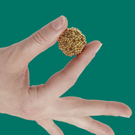 Speks Gold Mini Magnet Balls in hand