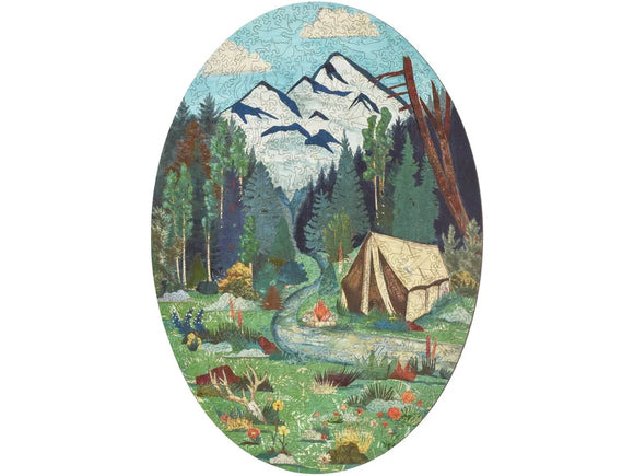 Picture of a tent in the mountains, by a stream