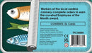 The back of the Sunny Day Sardines game box by 25th Century Games, featuring colorful illustrations of sardines and text describing the content of the game, which includes 56 cards. It mentions the game theme about workers at a sardine cannery and highlights the goal of becoming Employee of the Month.