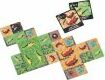 A colorful board game titled 'Chomp' made by Allplay, featuring various animal graphics and vibrant colors. The game includes multiple tiles arranged on a flat surface, showcasing play elements such as crocodiles and insects, creating an interactive and engaging gameplay experience.