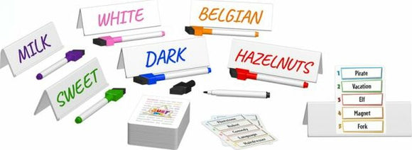 A colorful board game setup featuring cards and writing cards labeled with various categories such as 'MILK', 'DARK', and 'HAZELNUTS'. The game includes player markers and a deck of question cards, encouraging creativity and engagement in gameplay.