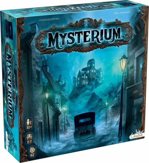 Mysterium board game box by Libellud featuring an eerie design with a foggy street and a haunted mansion in the background. The artwork captures a mysterious and atmospheric setting. The box shows player age 10+, 2-7 players, and playtime of 42 minutes.