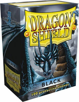Dragon Shields Black featuring a dragon design on the front of the box, showcasing 100 premium protective sleeves for card games. The box displays the brand logo and highlights the color and quantity of the sleeves.