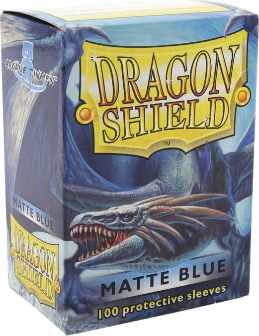 A box of Dragon Shields Matte Blue, featuring a vibrant dragon design on the packaging. The box claims to contain 100 protective sleeves designed for card games, showcasing a fantasy and gaming theme that appeals to collectors and players alike.