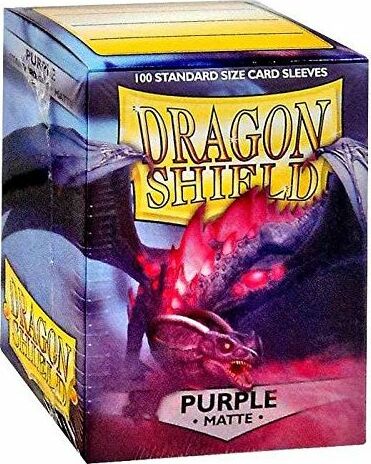 A box of Dragon Shields featuring 100 matte purple card sleeves. The front of the box showcases the Dragon Shield logo, with a vibrant purple dragon graphic, ideal for protecting collectible trading cards.