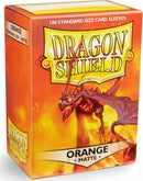 Dragon Shields Matte Orange card sleeves packaging, featuring a fierce dragon design. The box contains 100 standard size sleeves, ideal for protecting trading cards during gameplay.