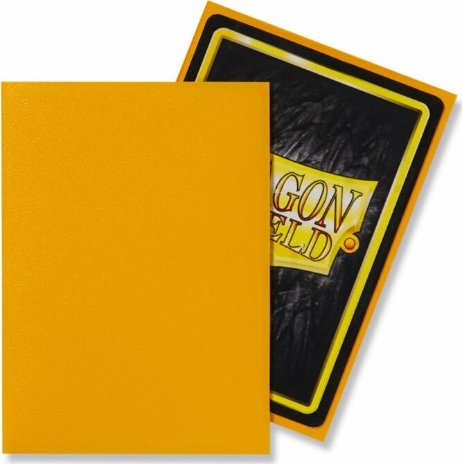 A pack of 100 matte yellow Dragon Shields card sleeves. The image shows one sleeve in front of the packaging, highlighting its vibrant yellow color and the Dragon Shield logo.