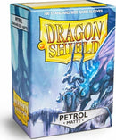 A product box of Dragon Shields featuring 100 standard size matte card sleeves in a petrol color. The design showcases a dragon theme with icy blue hues, ideal for protecting gaming cards.