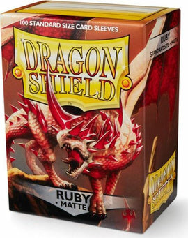 Package of Dragon Shields featuring 100 standard size matte sleeves in vibrant ruby color. The front showcases a ferocious red dragon, symbolizing protection and fantasy gaming.