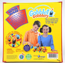 Gobblet Gobblers game box featuring colorful graphics. Includes a wooden game board, 12 wooden gobblers, and illustrated rules. Two children, a boy and a girl, are shown playing the game. The box highlights the gameplay, which is similar to Tic-Tac-Toe, and emphasizes its suitability as a first strategy board game for kids aged 5 and up, including a quote from Dr. Toy.
