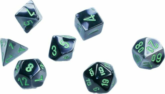 A set of Mini Gemini RPG dice in a striking black-grey design with vibrant green numbers. The set includes various polyhedral shapes, perfect for tabletop gaming.