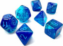 Chessex Gemini blue and light blue luminous polyhedral dice set. The set includes various shapes, featuring transparent blue material with engraved white numbers, perfect for tabletop games.