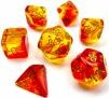 A set of vibrant Gemini polyhedral dice in red, yellow, and gold colors, featuring various shapes including a dodecahedron, tetrahedron, and others, suitable for tabletop games and RPGs.