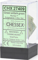 Chessex polyhedral 7-die set in marble green and dark green colors. The set is housed in a clear plastic container with a black base, showcasing the unique dice inside. Ideal for tabletop gaming enthusiasts.