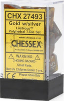 Chessex Lustrous Gold/Silver Polyhedral Dice Set featuring a transparent cube packaging. The set includes seven intricately designed polyhedral dice, characterized by a luxurious gold color with silver numbering, ideal for tabletop gaming and role-playing games.
